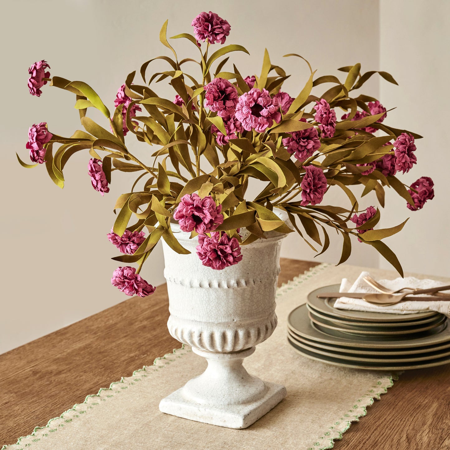 Purple Wildflower Bush shown in vase on dining room table