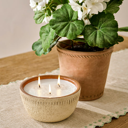 Magnolia Daybreak Rustic Bowl Candle shown on table