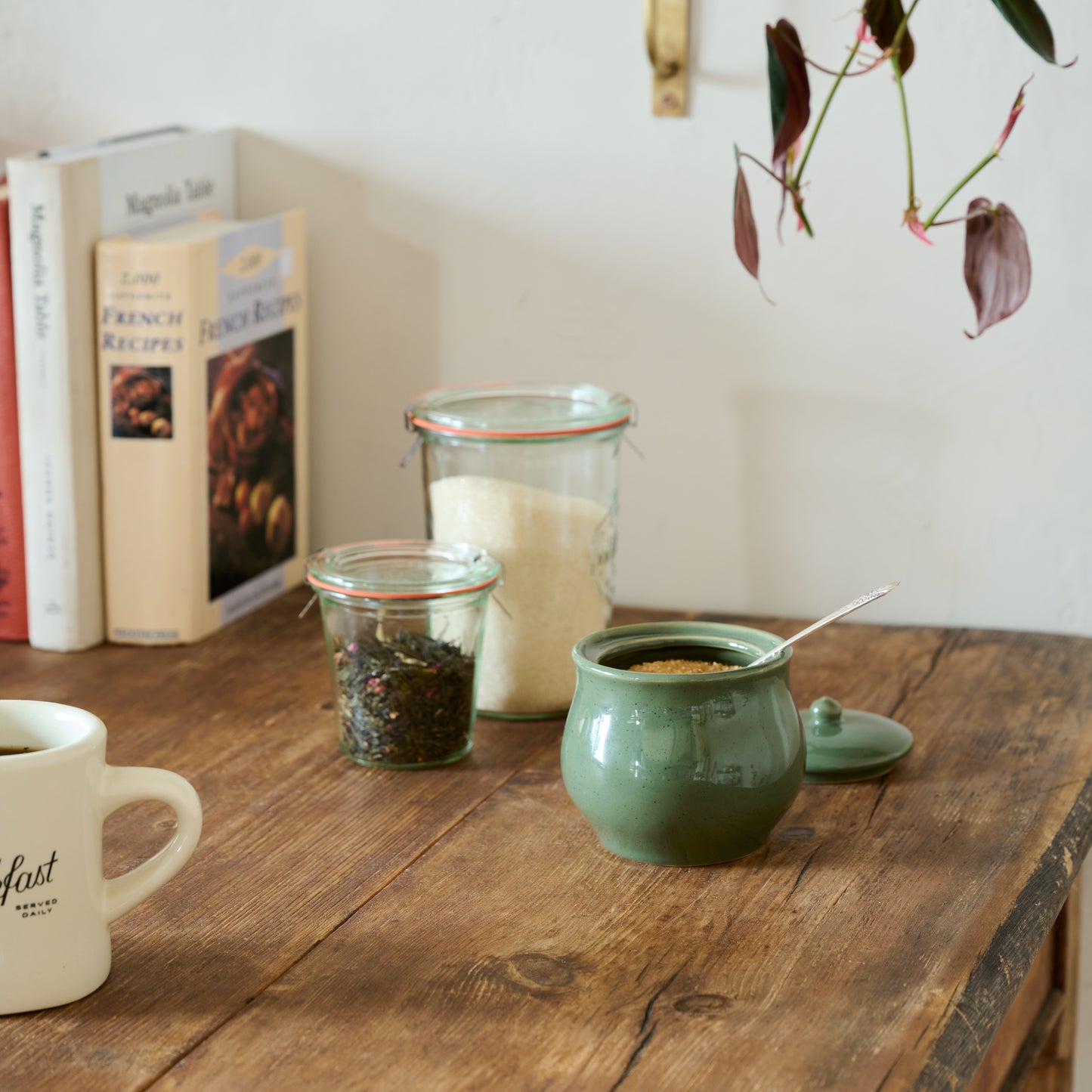 The Cottage Collection Forest Green Speckle Sugar Jar shwon on table