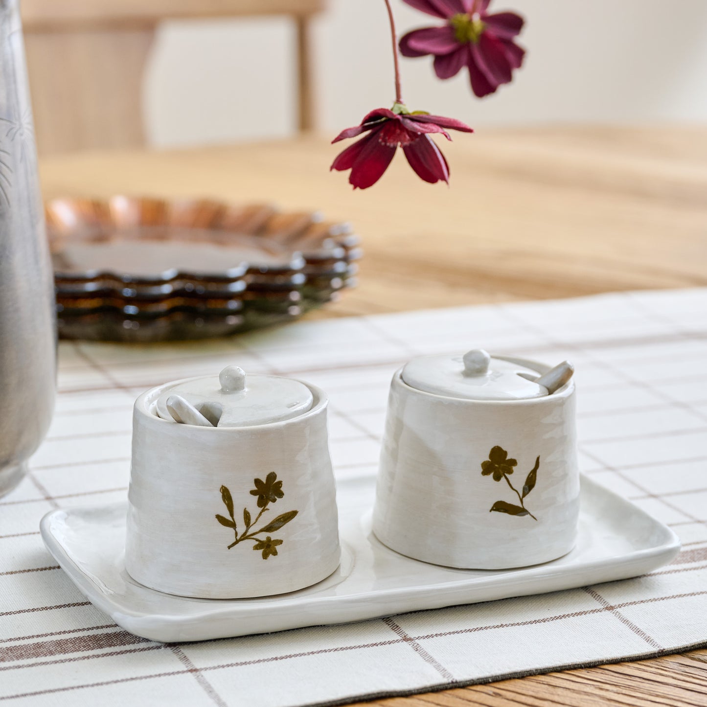 Eliana Floral Ceramic Salt + Pepper Set shown on table
