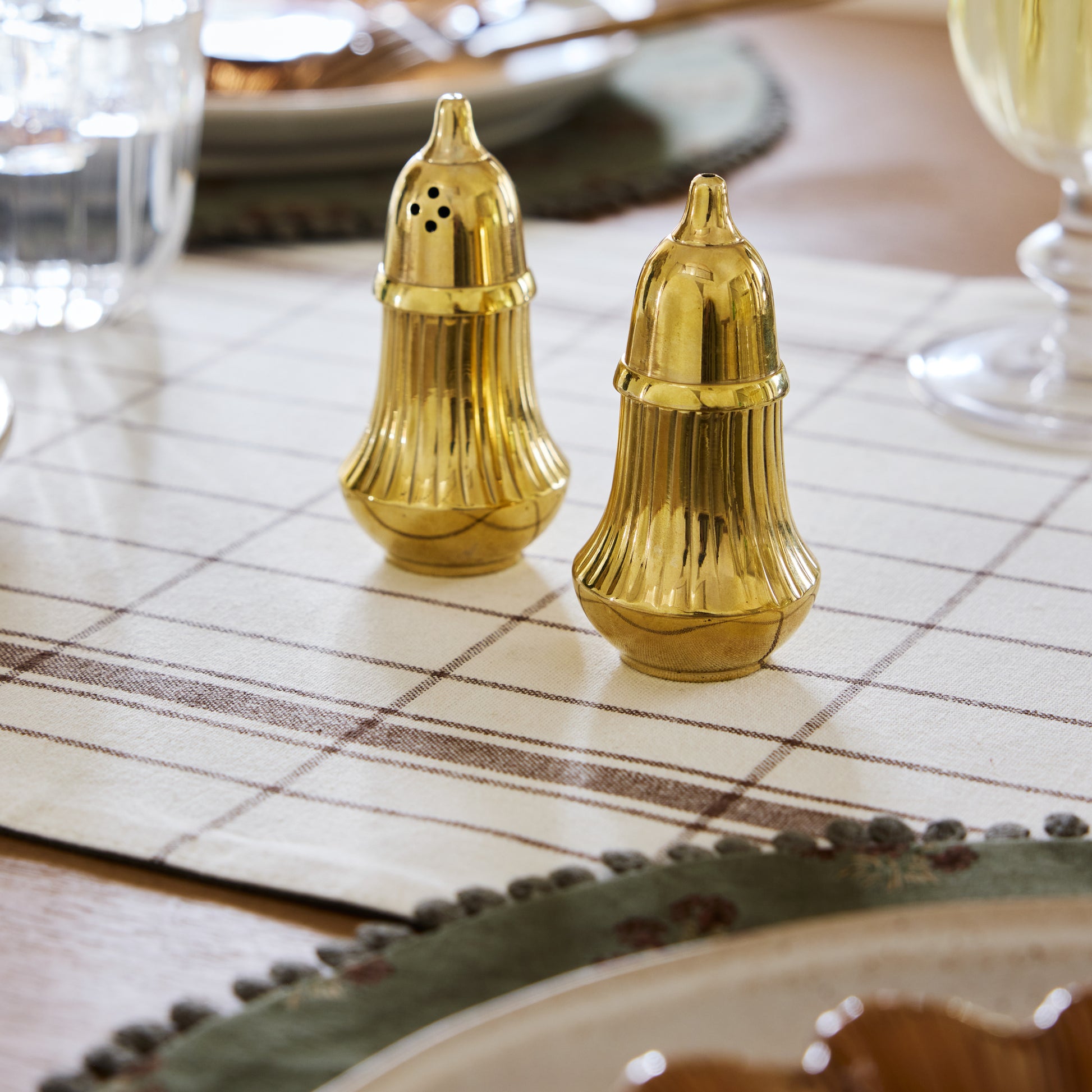 Brass Salt + Pepper Set on a set table
