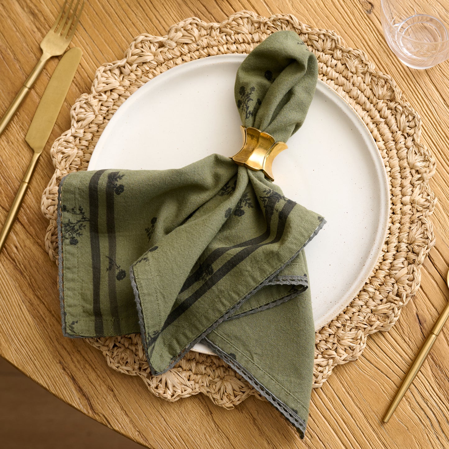 Magnolia Green Ditsy Rose Napkin Set of Four shown on table
