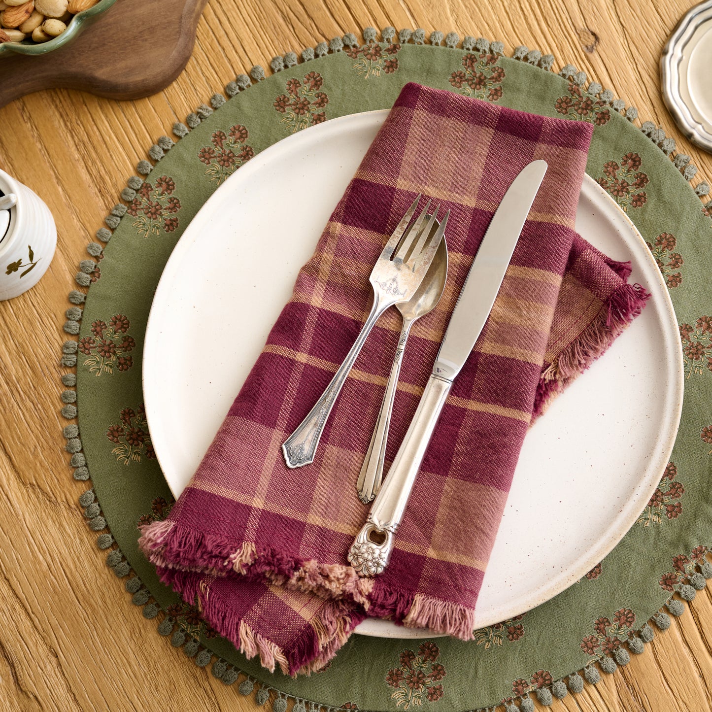 Magnolia Olive Green Block Printed Placemat Set of Four shown with plate