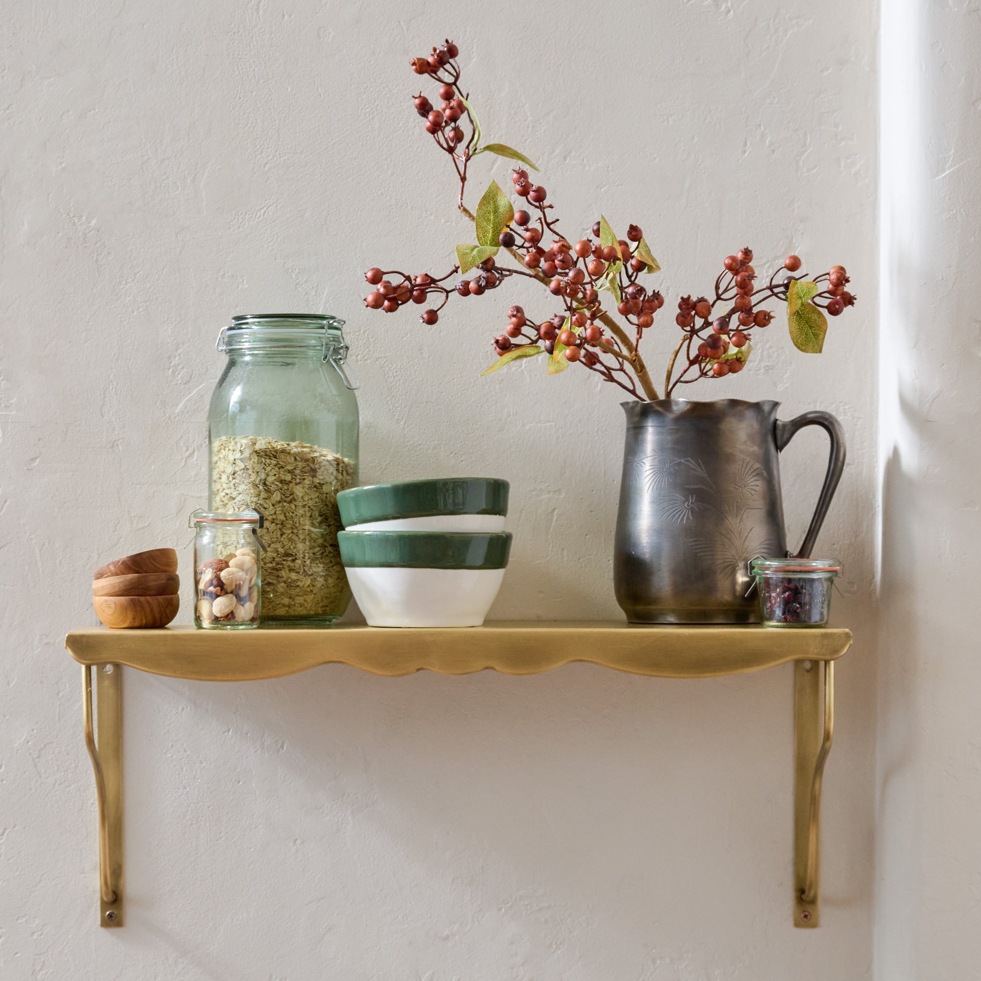 Rosalie Brass Scalloped Shelf shown styled on wall