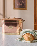 Magnolia Copper Bread Box shown on counter