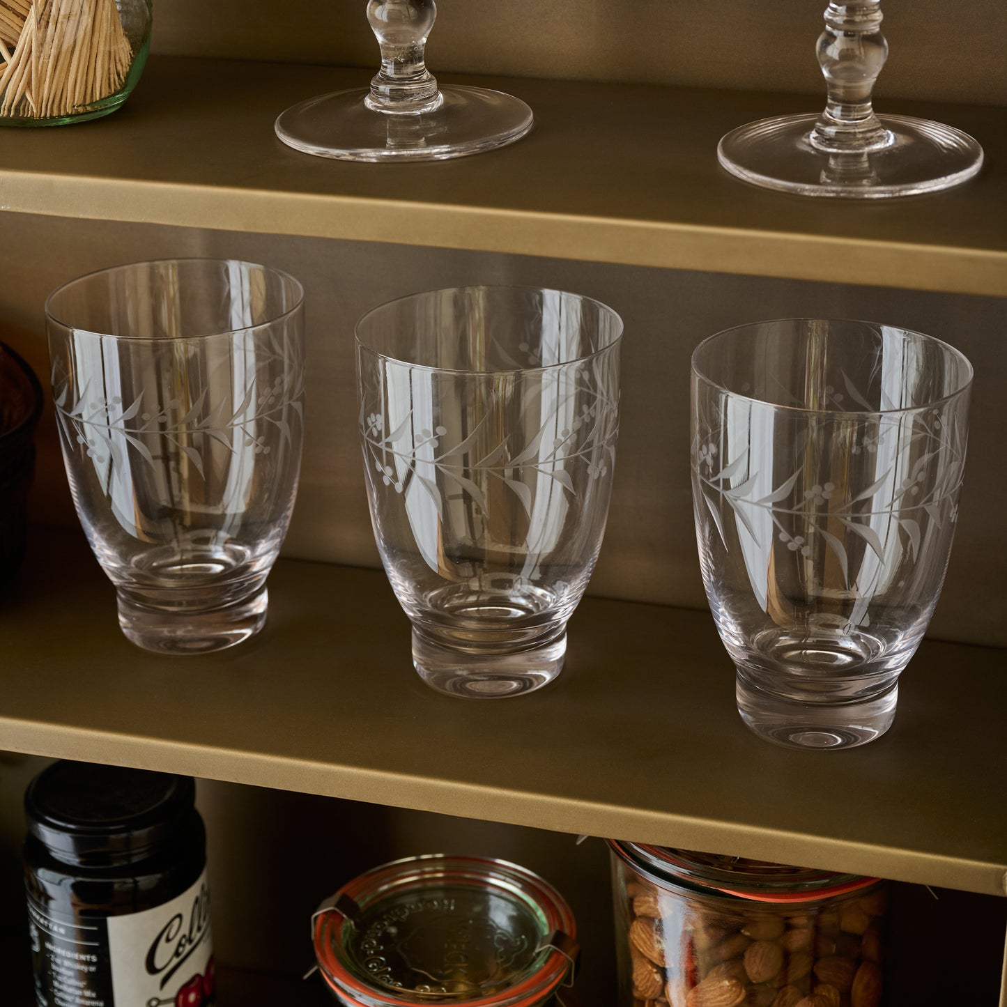Small Vintage-Inspired Etched Glass Tumblers shown on shelf