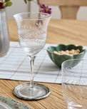 Vintage-Inspired Etched Glass Wine Glass shown on dining table