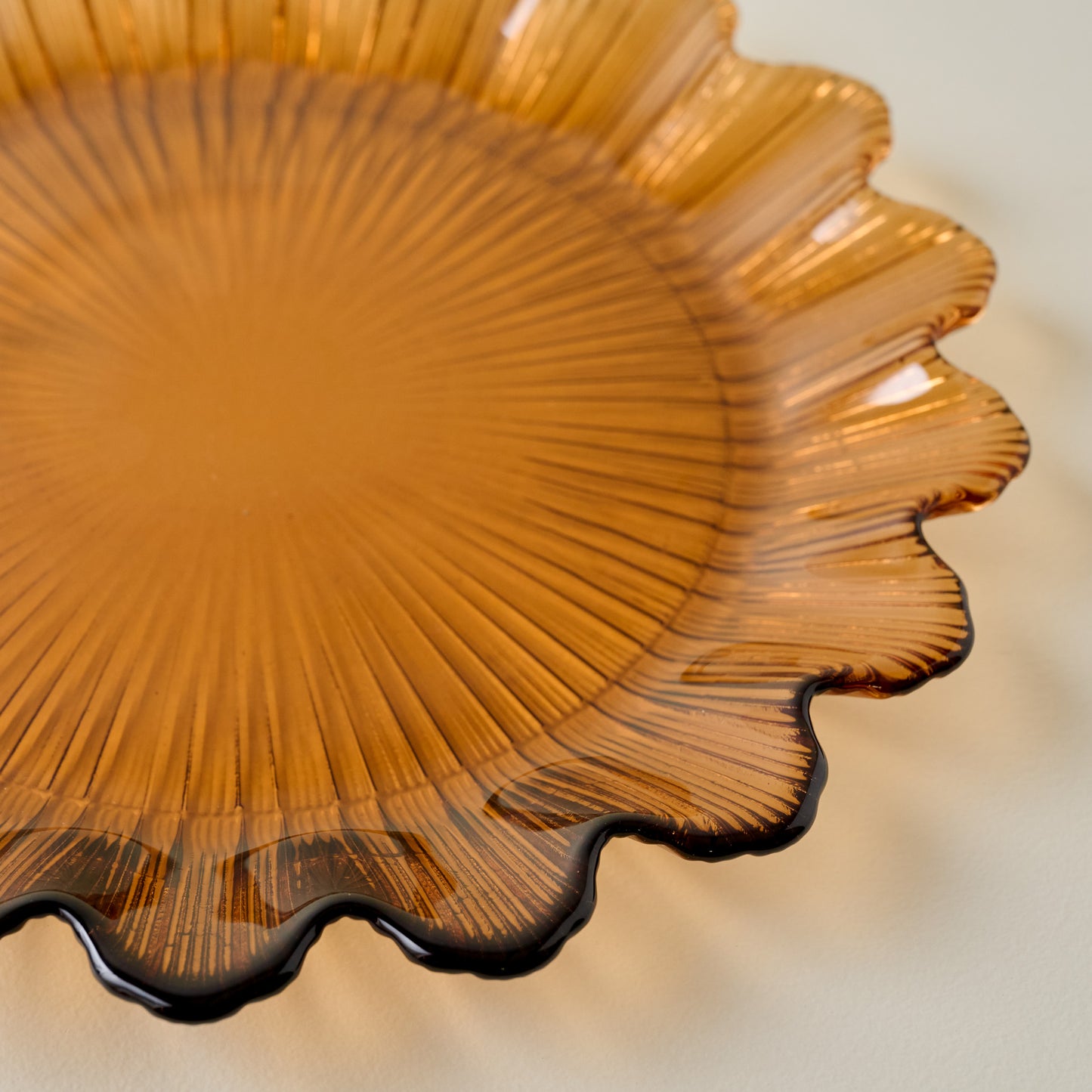 Emmeline Amber Scalloped Glass Plate up close