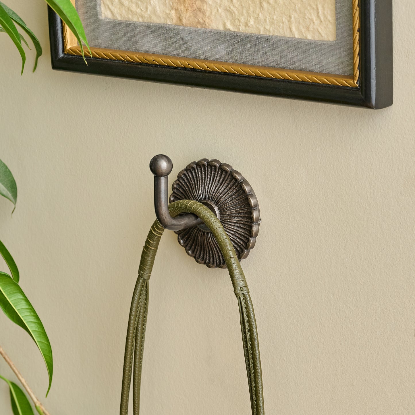 Shiloh Antiqued Bronze Wall Hook shown styled on wall