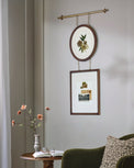 Colleen Wood and Brass Rail Multi Picture Frame shown on wall