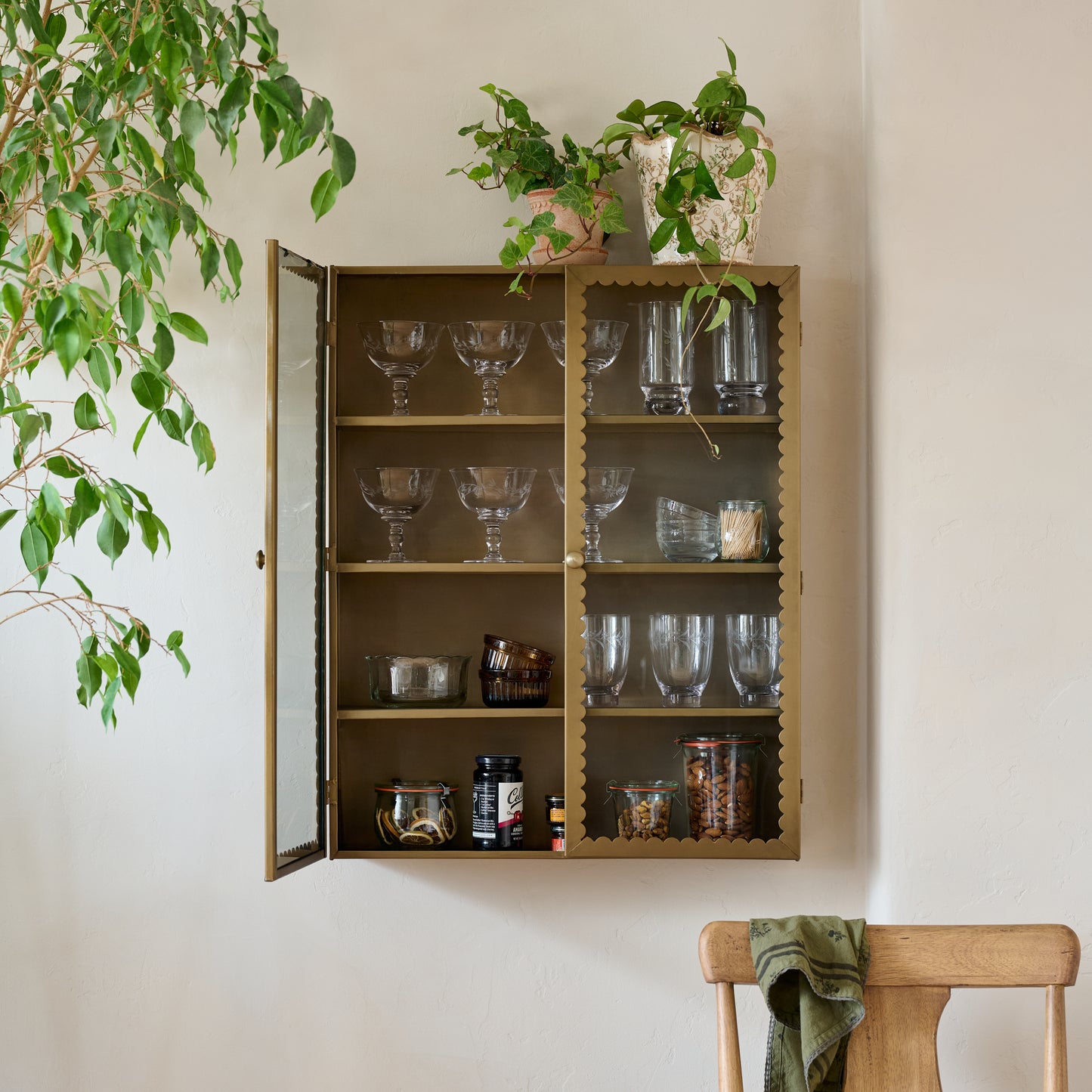Dottie Brass Scalloped Display Cabinet shown styled on wall