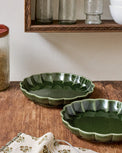 The Cottage Collection Forest Green Scalloped Baking Dish Set shown on table