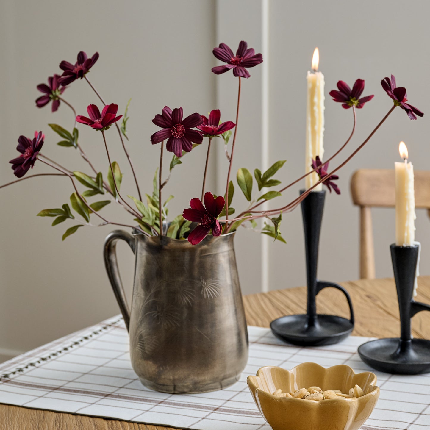 Burgundy Cosmos Stem shown on dining room table