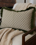 Thea Block Print Pillow w/ Velvet Ruffle Edge w/ insert, 16x24 shown on accent chair