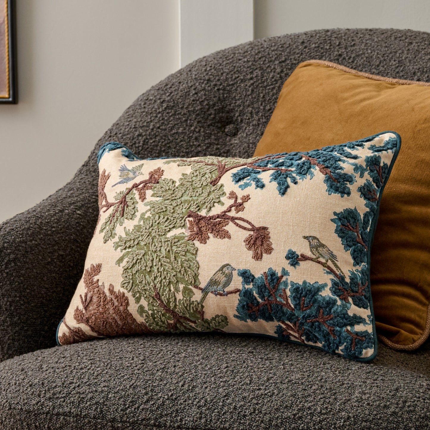 Bennett Embroidered Lumbar Pillow shown on accent chair