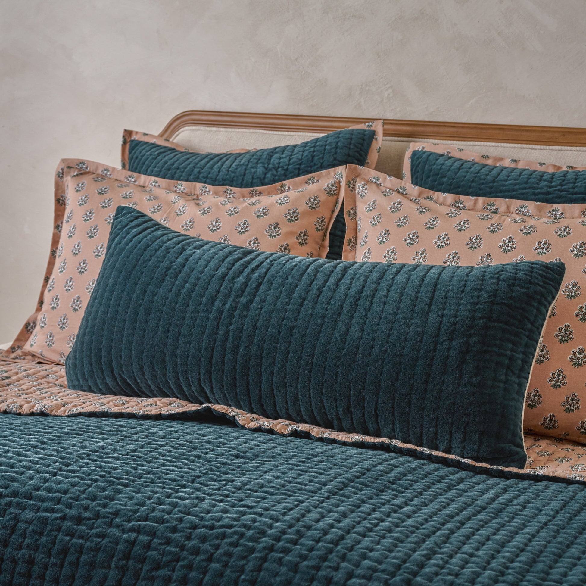 Audrey Velvet Lumbar Pillow- Magical Forest shown on bed
