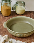 The Cottage Collection Laurel Green Round Baking Dish shown on table