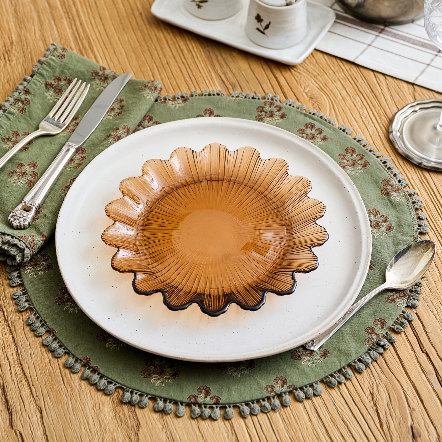 Magnolia Olive Green Block Printed Placemat Set of Four shown on table