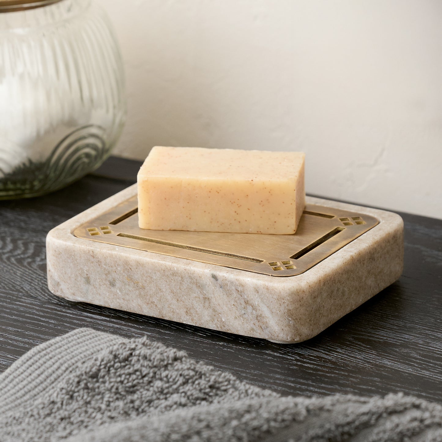 Quincey Marble and Brass Inlay Soap Dish in beige shown with bar of soap