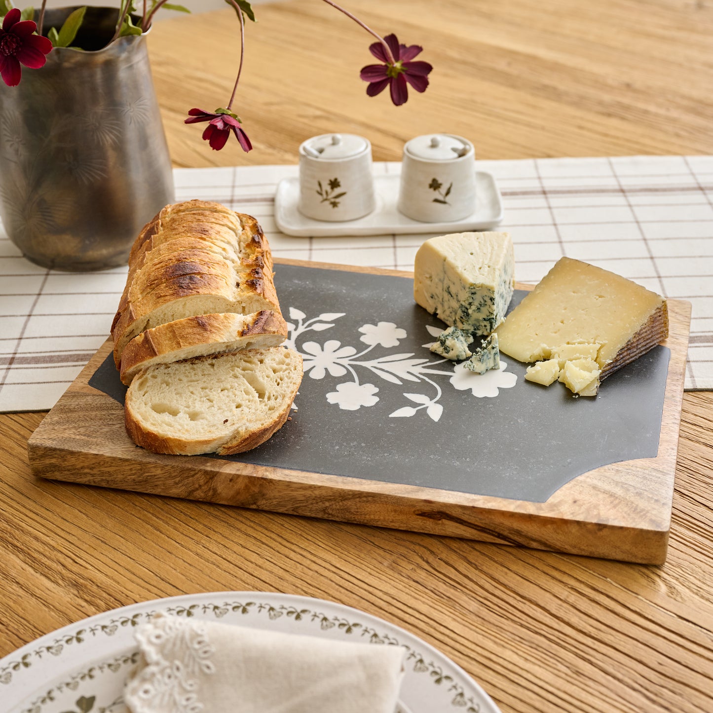 Elenora Marble Serving Board shown on table with food
