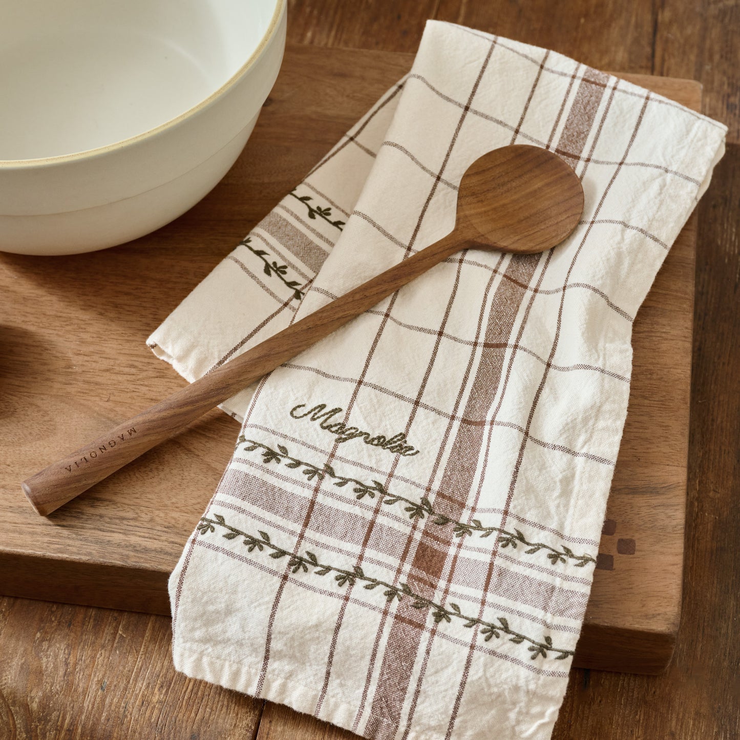 Talia Woven Grid Tea Towel shown on table with wooden spoon