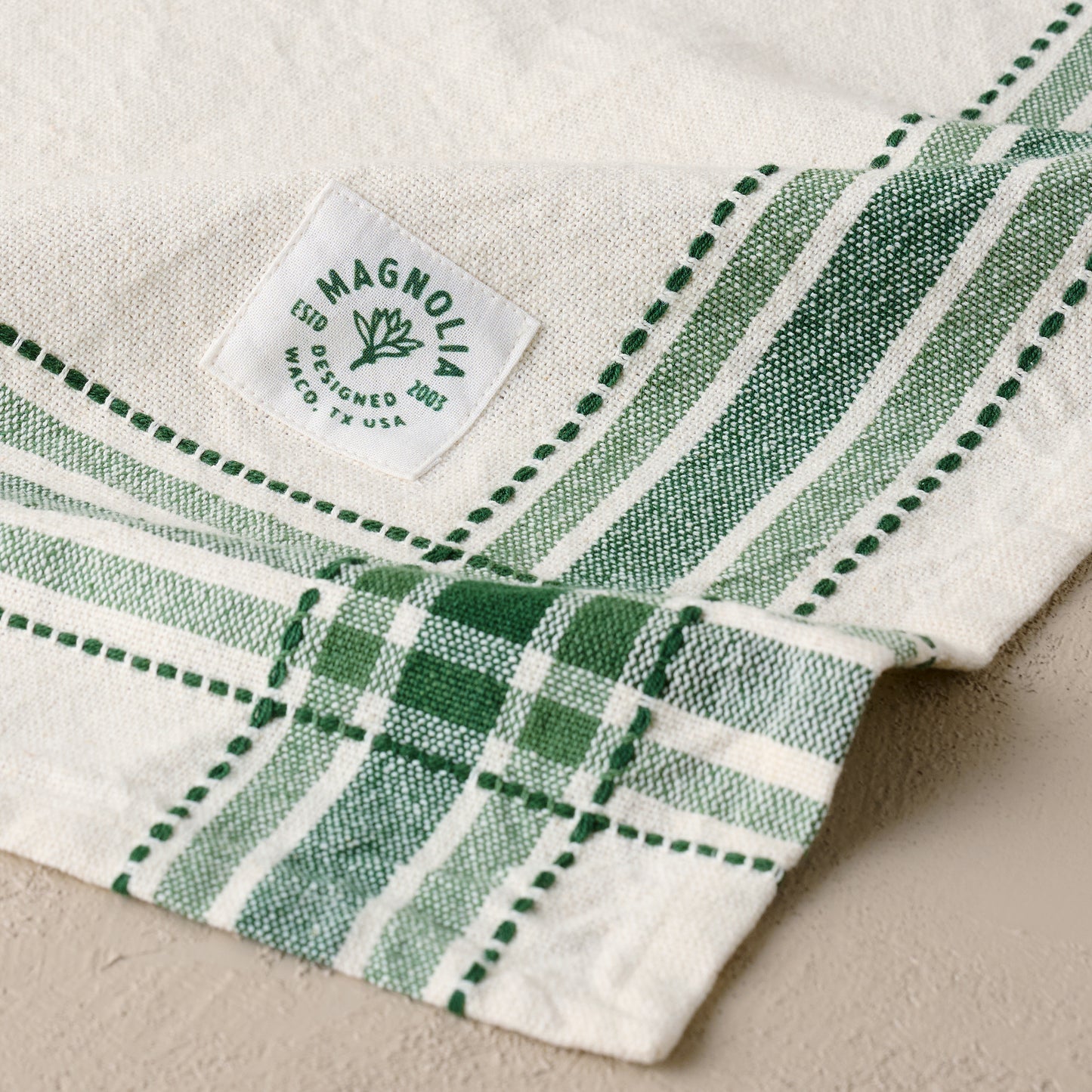 Magnolia Vintage Green Border Tea Towel corner up close
