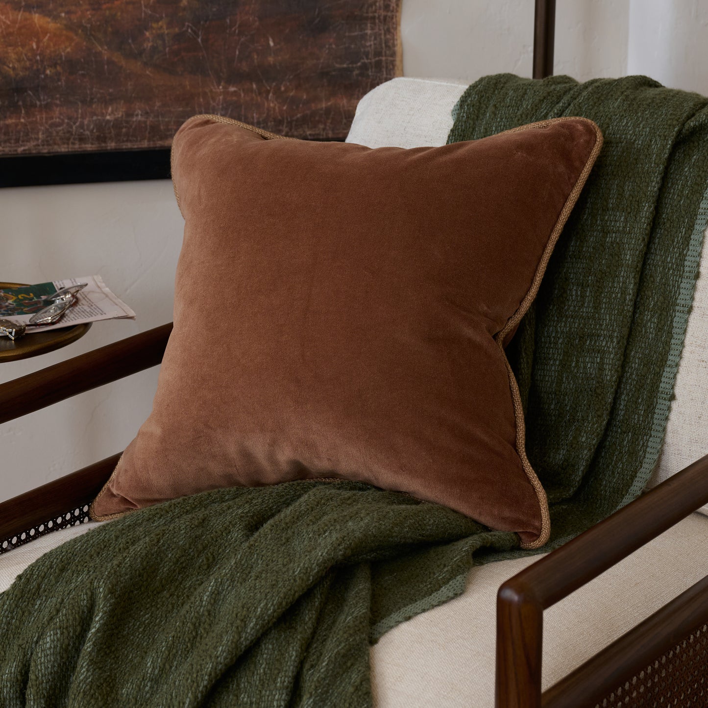 Lexie Velvet Pillow in Mocha shown on accent chair