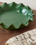 The Cottage Collection Forest Green Scalloped Pie Dish shown on table