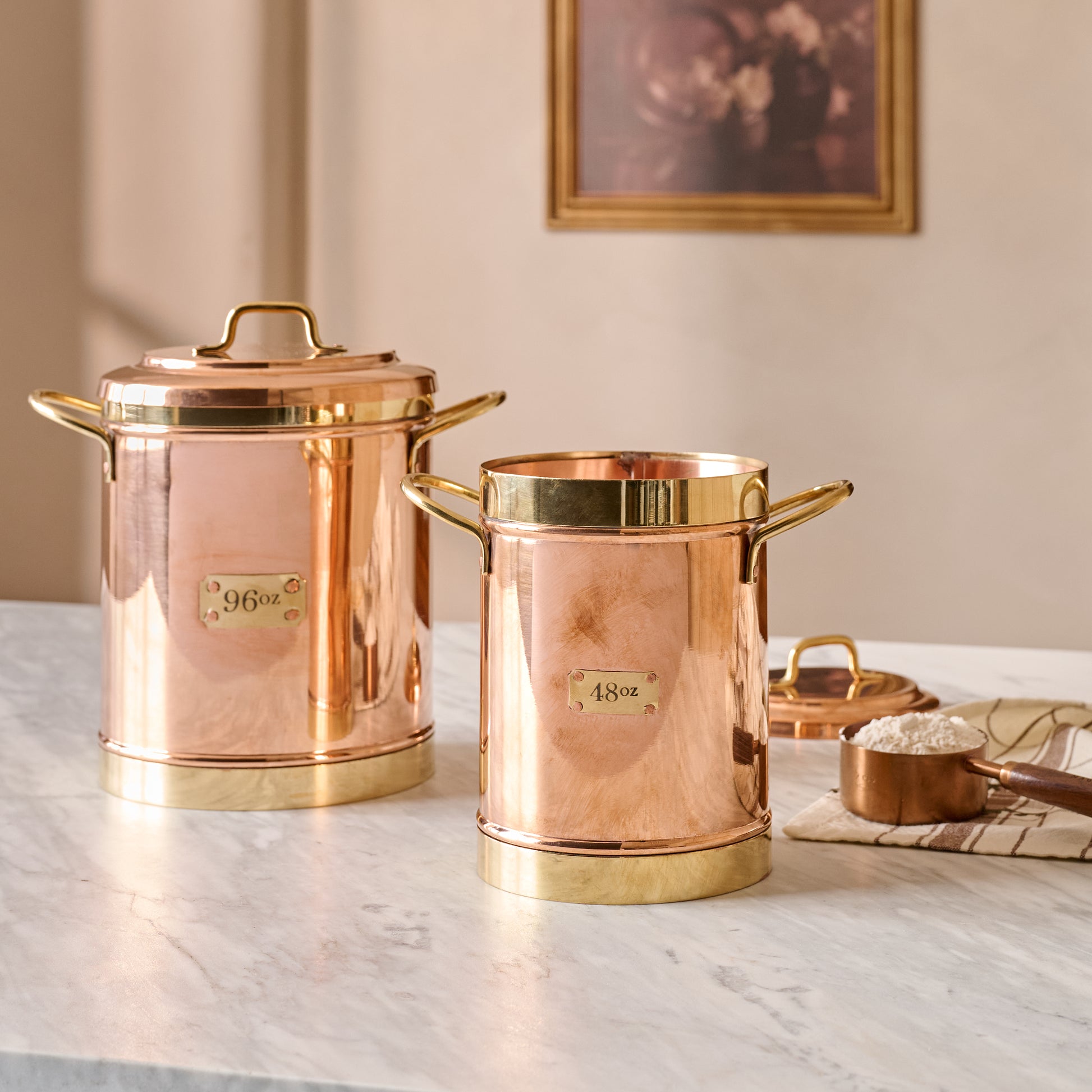 Vintage Inspired Copper + Brass Canisters shown on counter