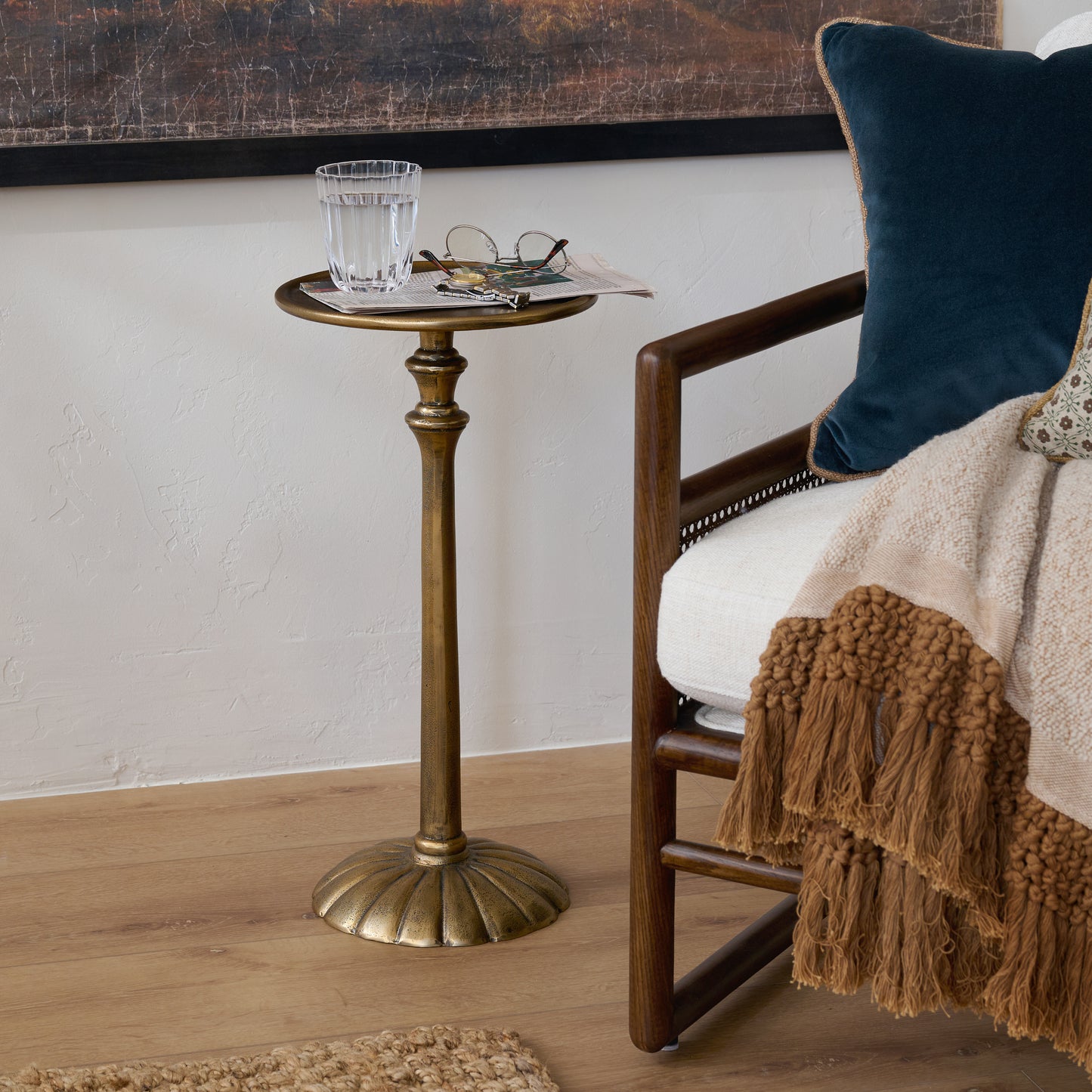 Antiqued Brass Cocktail Table shown next to accent chair