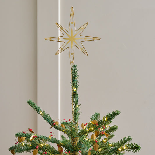 Twisted Brass Star Tree Topper shown on top of tree