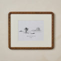 Nicolette Carved Wood Photo Frame in size 8x10 hanging on beige wall