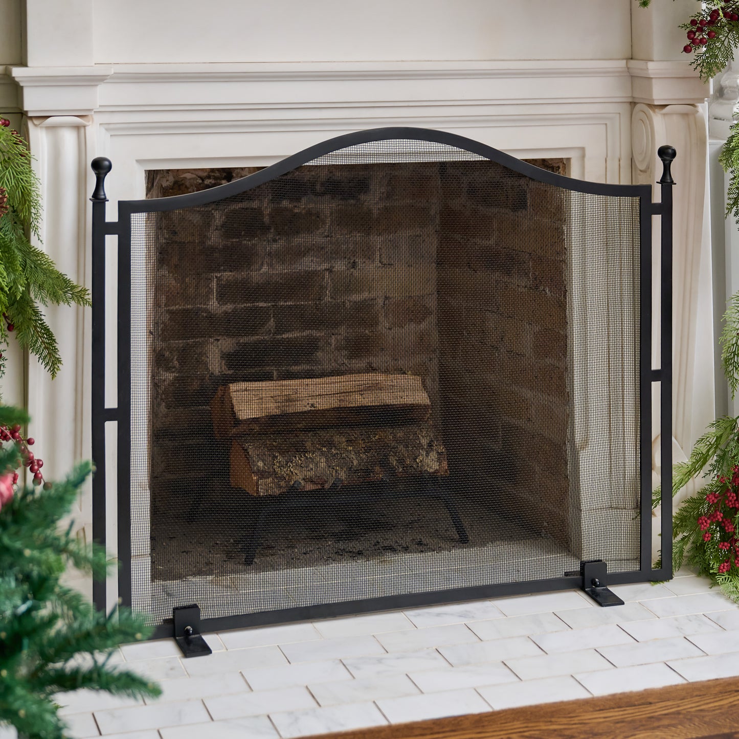 Shepherd Black Fireplace Screen shown in front of fireplace