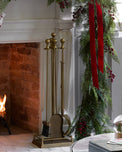 Shepherd Brass Fireplace Toolset shown by fireplace