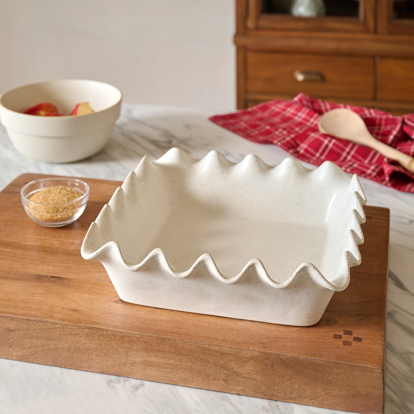 French White Scalloped 9x9 Baking Pan shown set on counter
