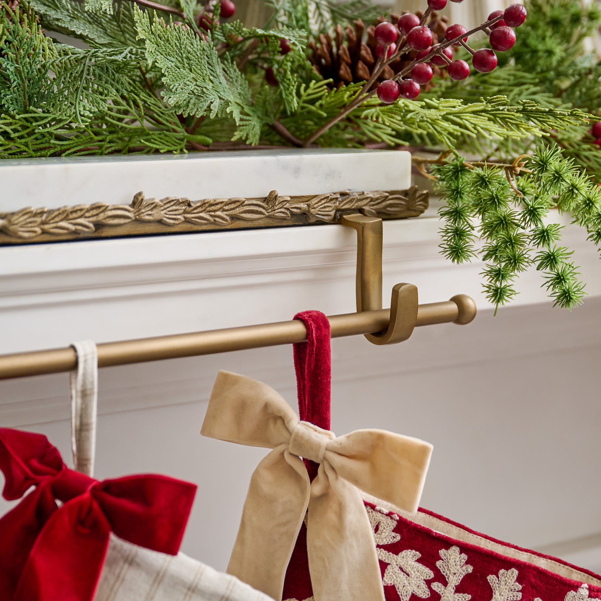 Marble and Gilded Multi Stocking Holder shown holding stockings