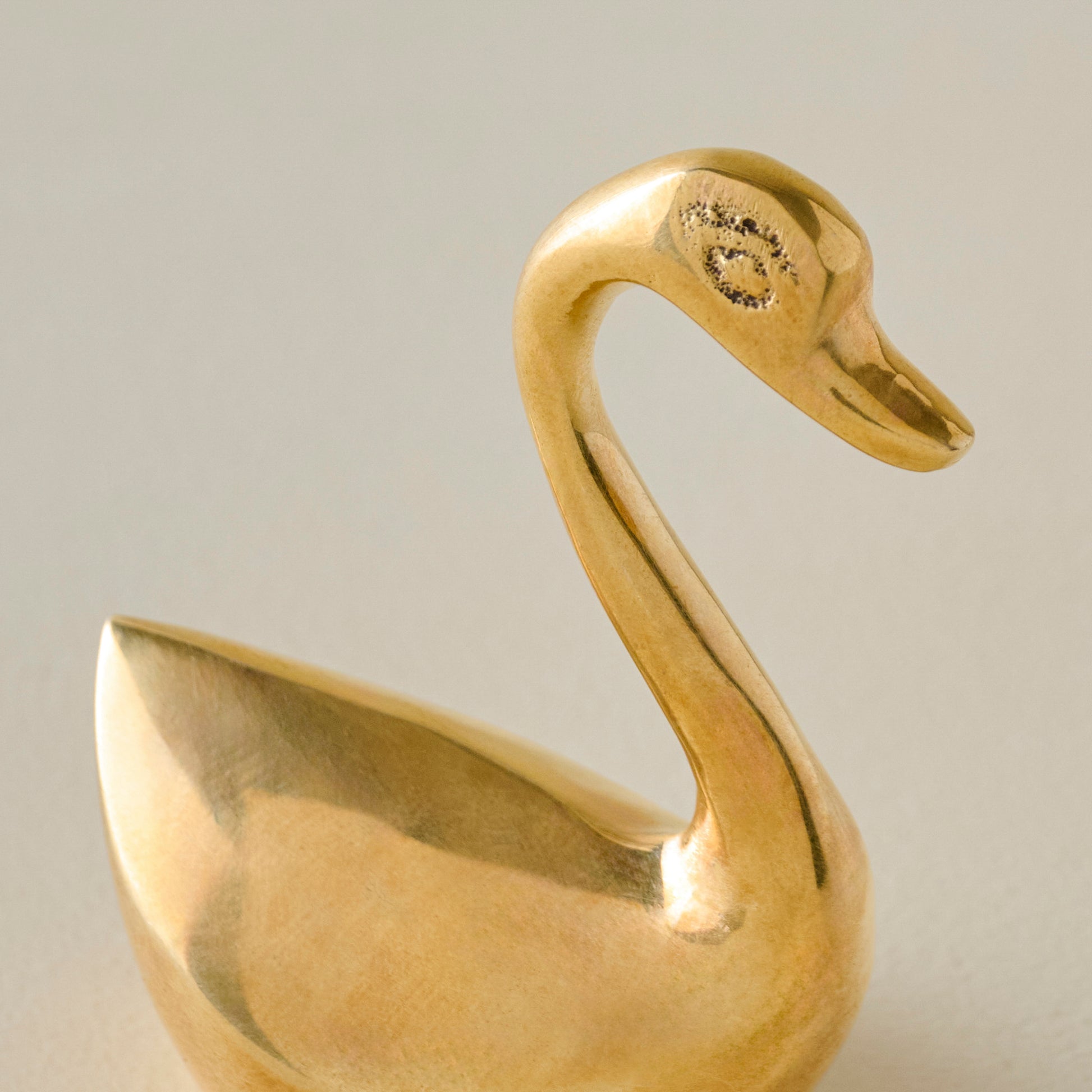 Small Vintage-Inspired Brass Sit About Swan Up Close
