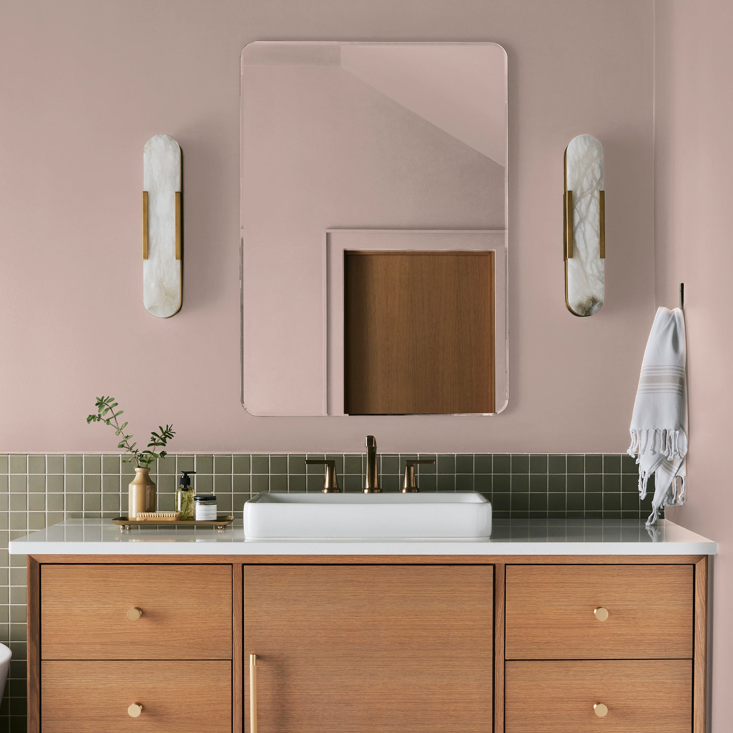 muted light pink paint named ella rose painted on bathroom wall