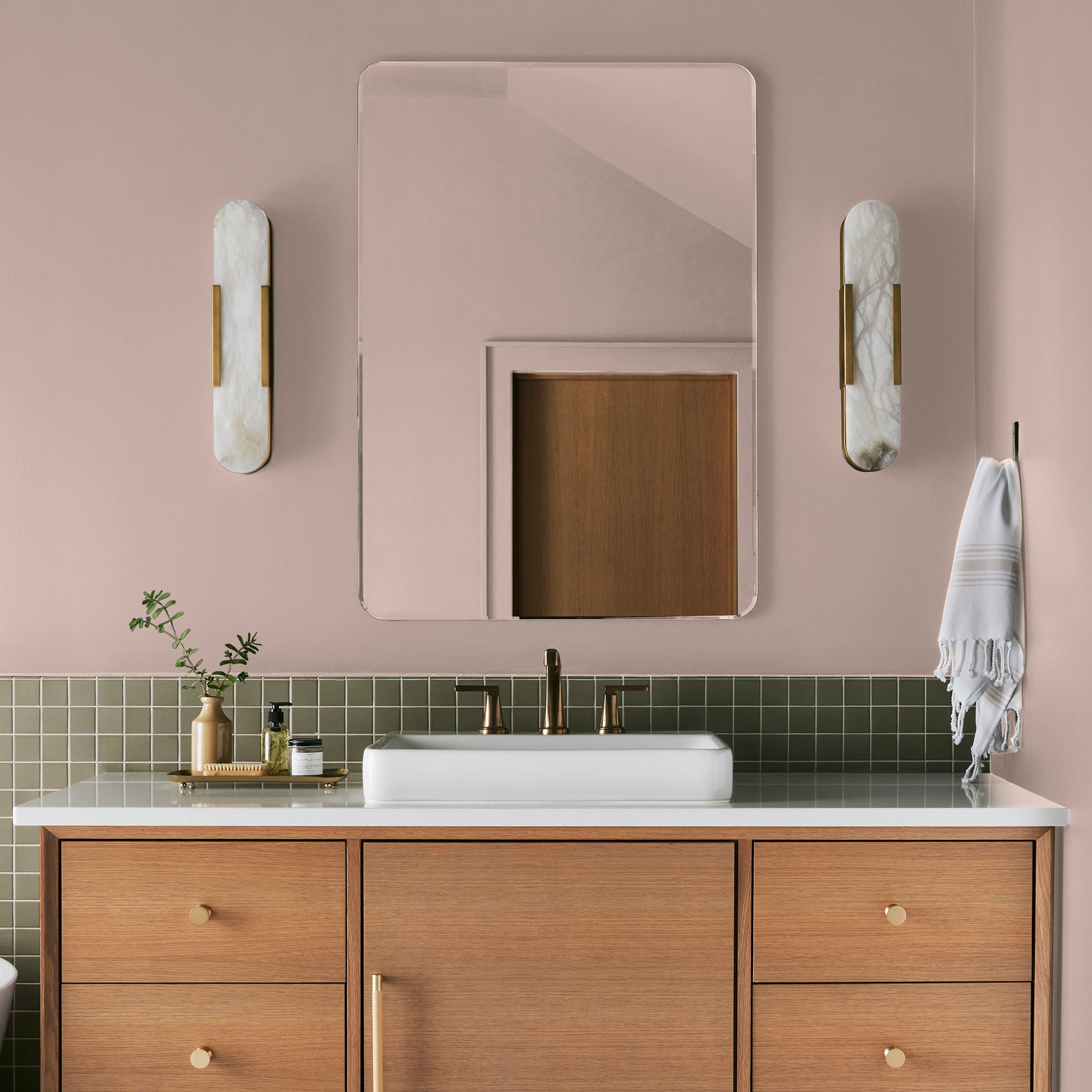 muted light pink paint named ella rose painted on bathroom wall