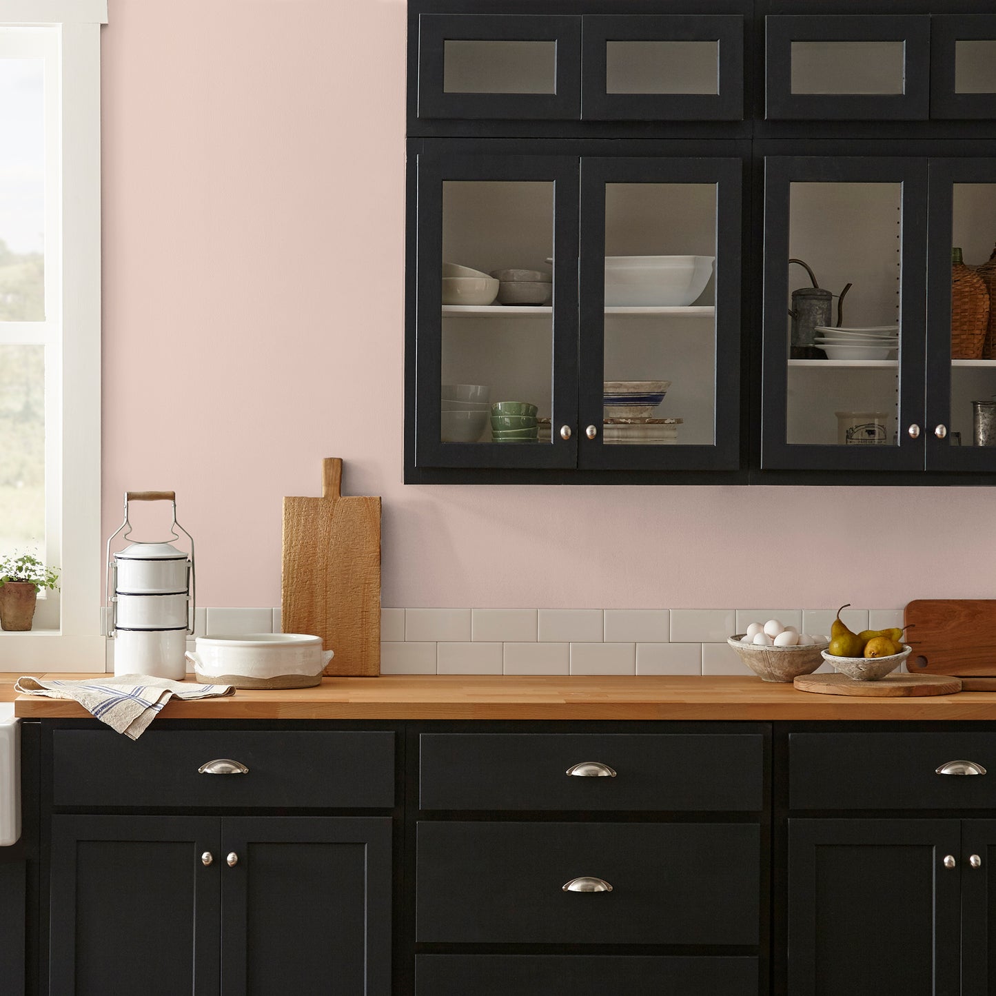 muted light pink paint named ella rose painted on kitchen wall