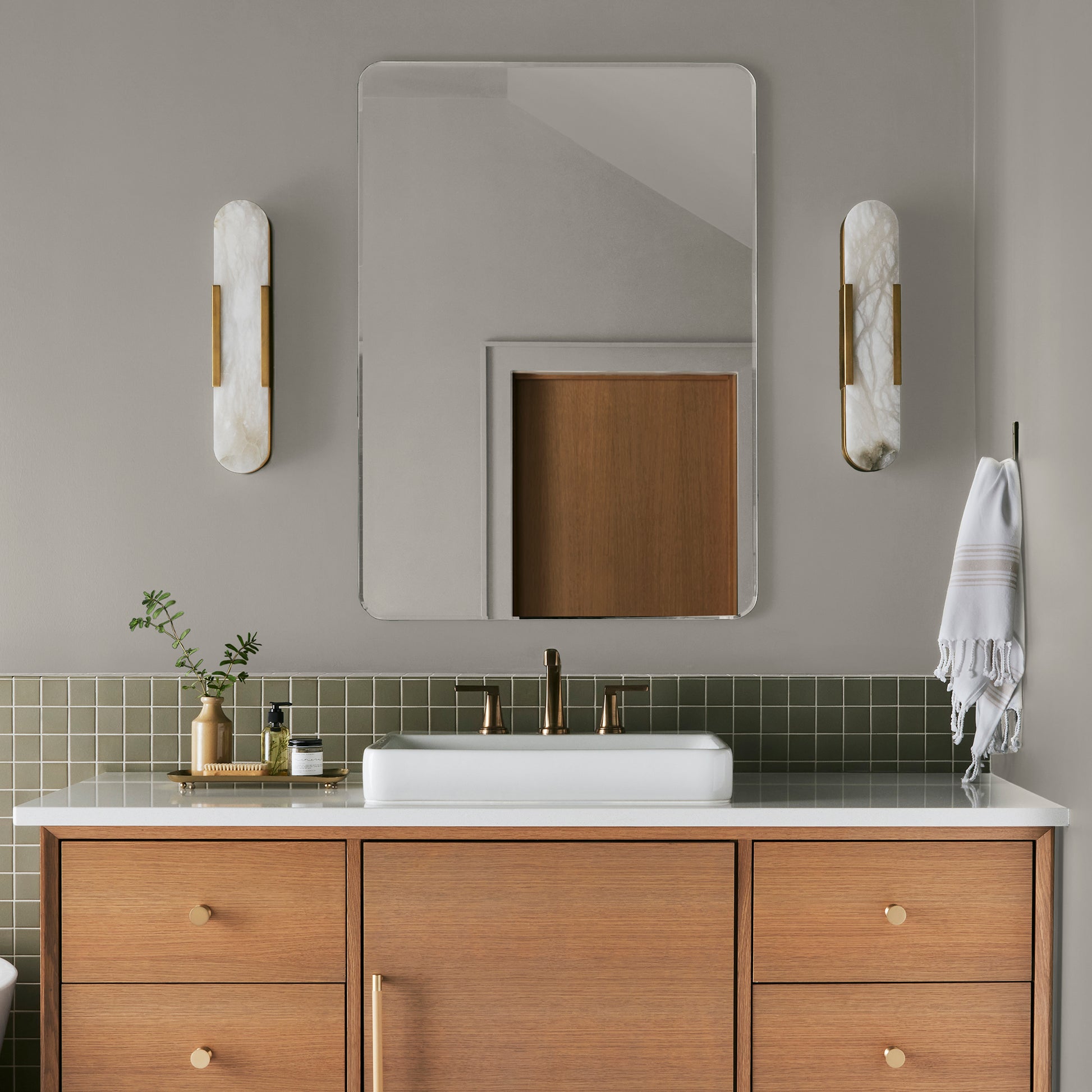 medium warm grey paint named sunday stroll shown painted on bathroom wall