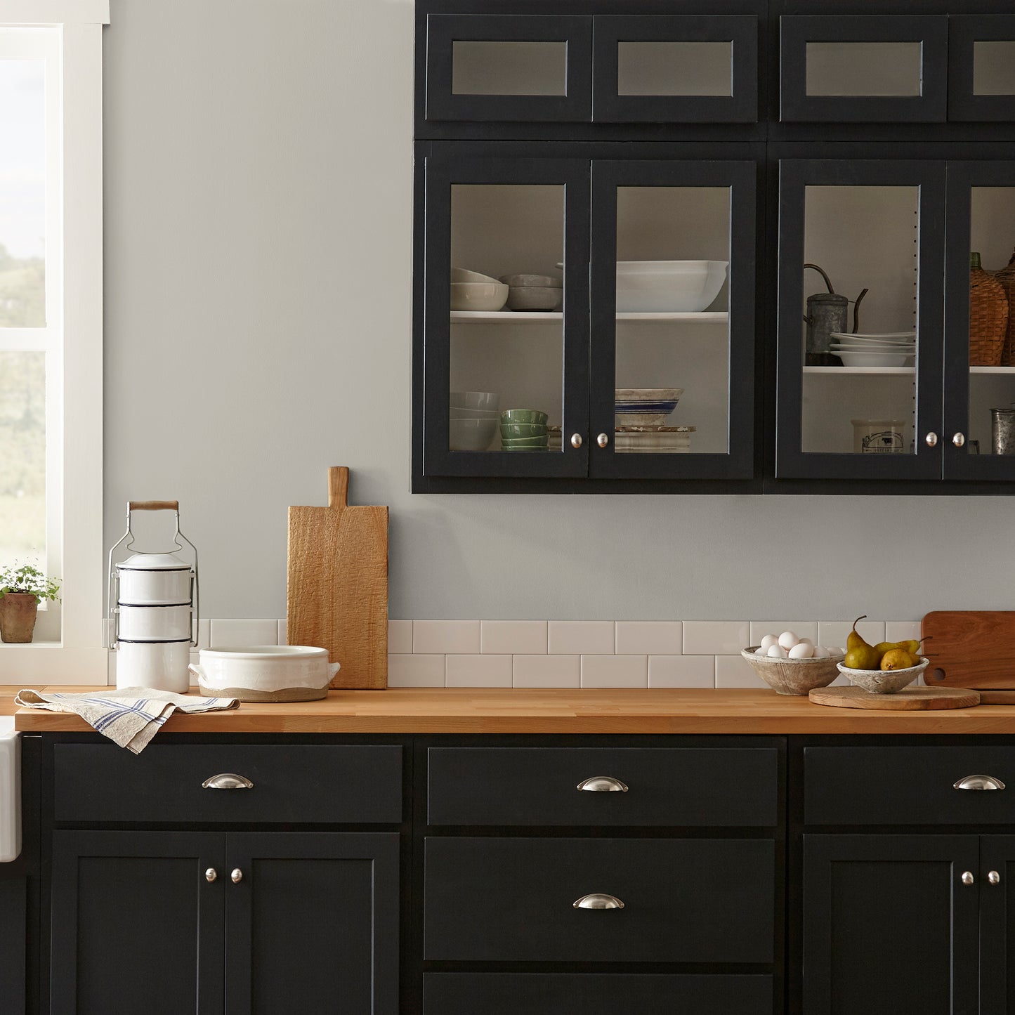 medium warm grey paint named sunday stroll shown painted on kitchen wall