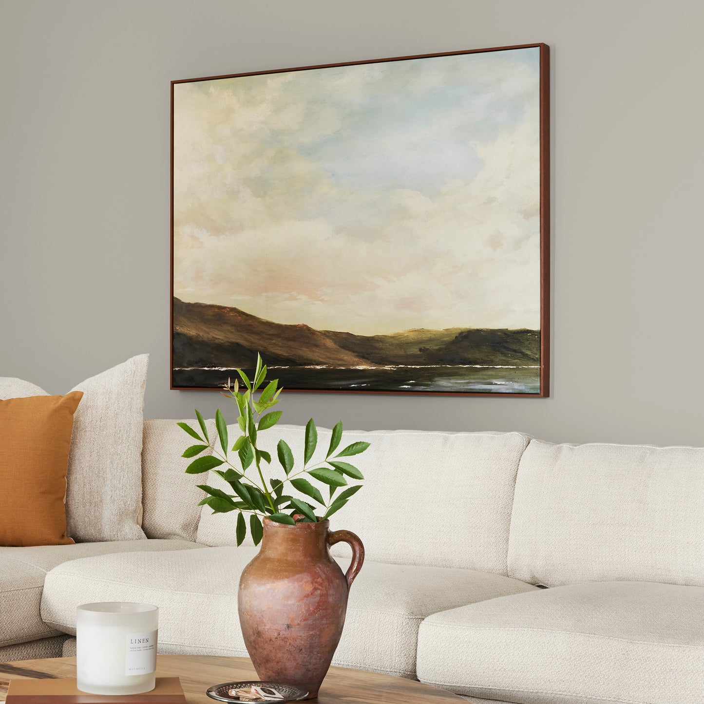 medium warm grey paint named sunday stroll shown painted on living room wall
