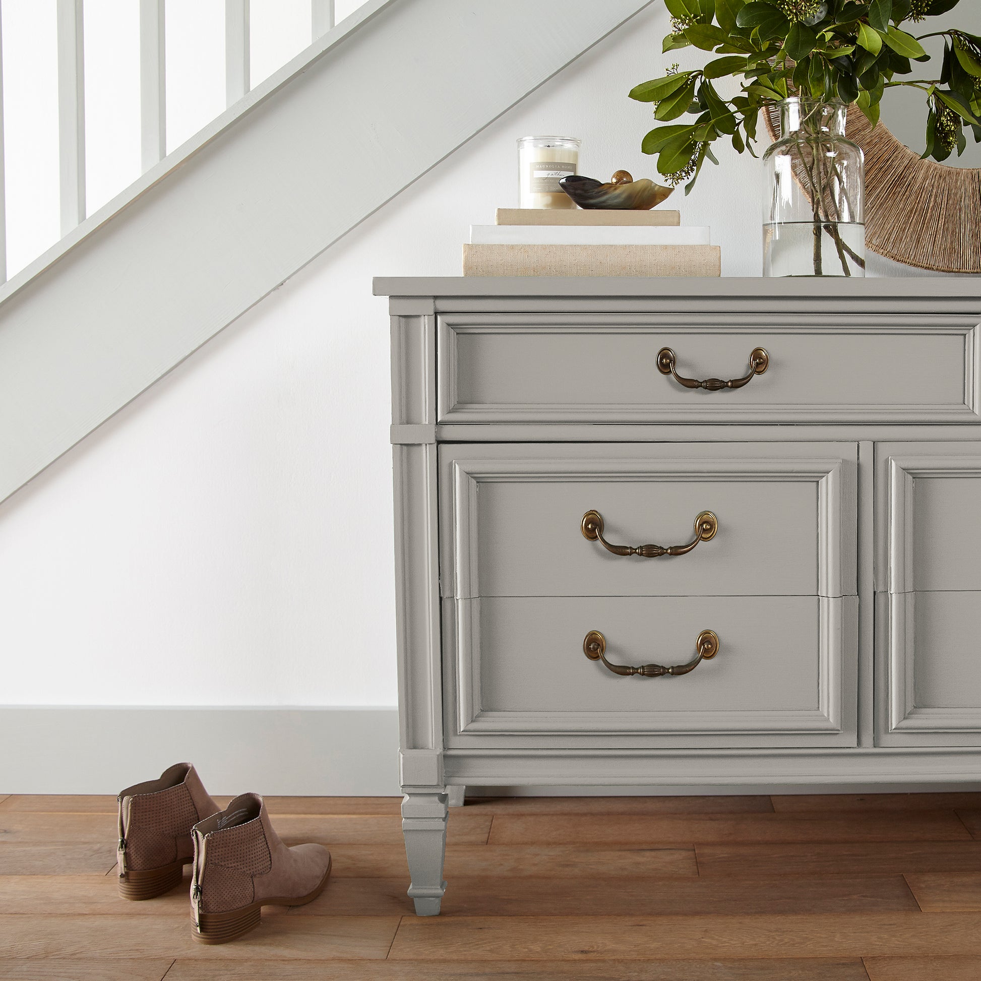 medium warm grey paint named sunday stroll shown painted on entryway cabinet
