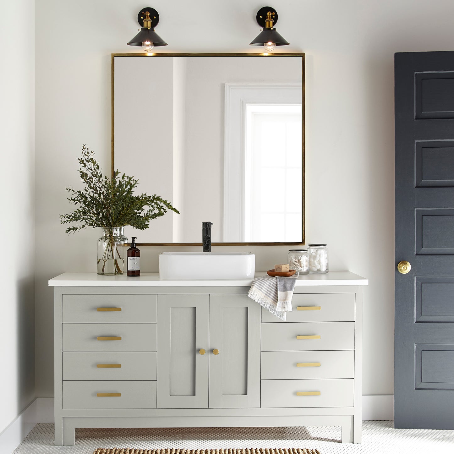 Warm white with a light beige tint named one horn white shown painted on bathroom cabinet
