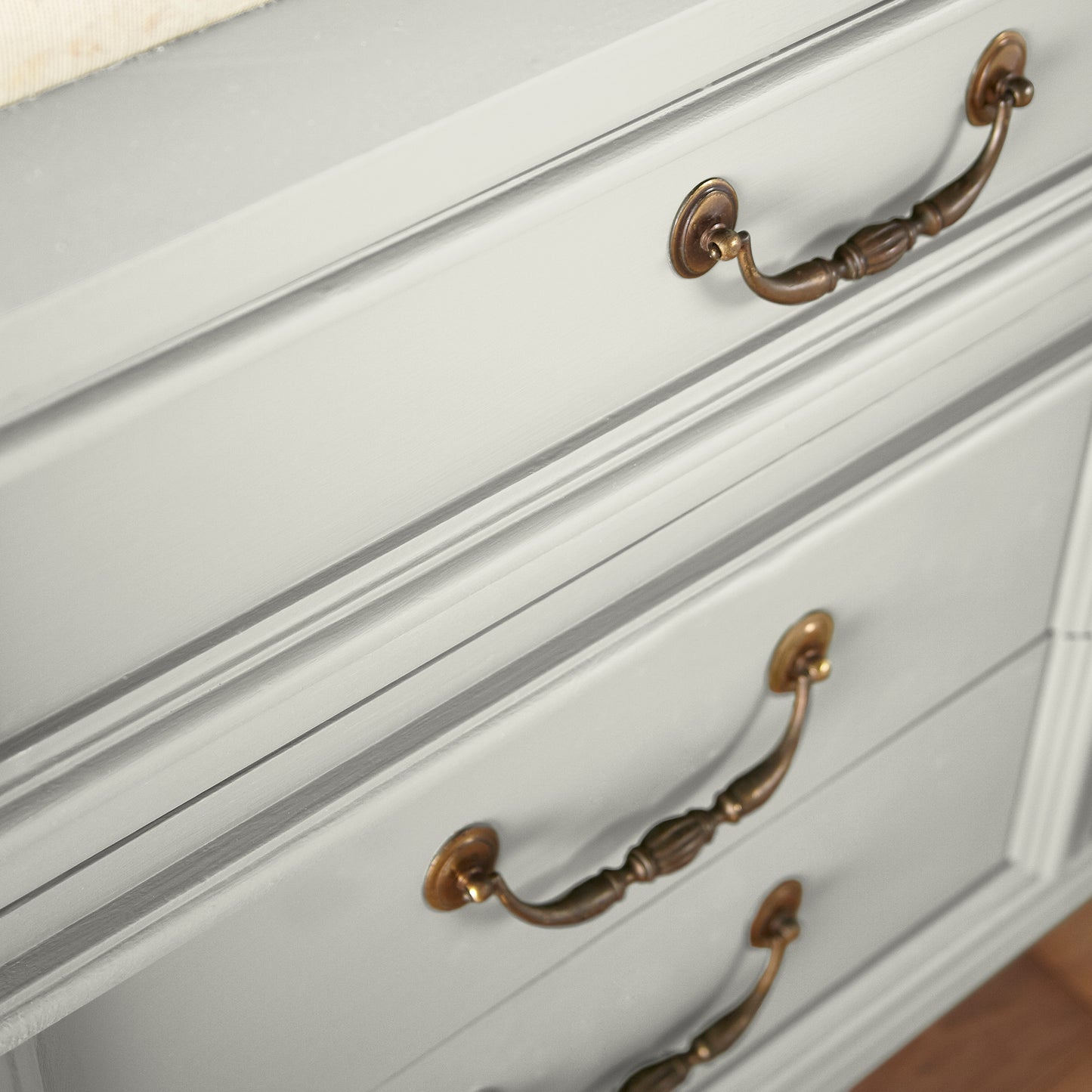 Warm white with a light beige tint named one horn white shown painted on cabinet