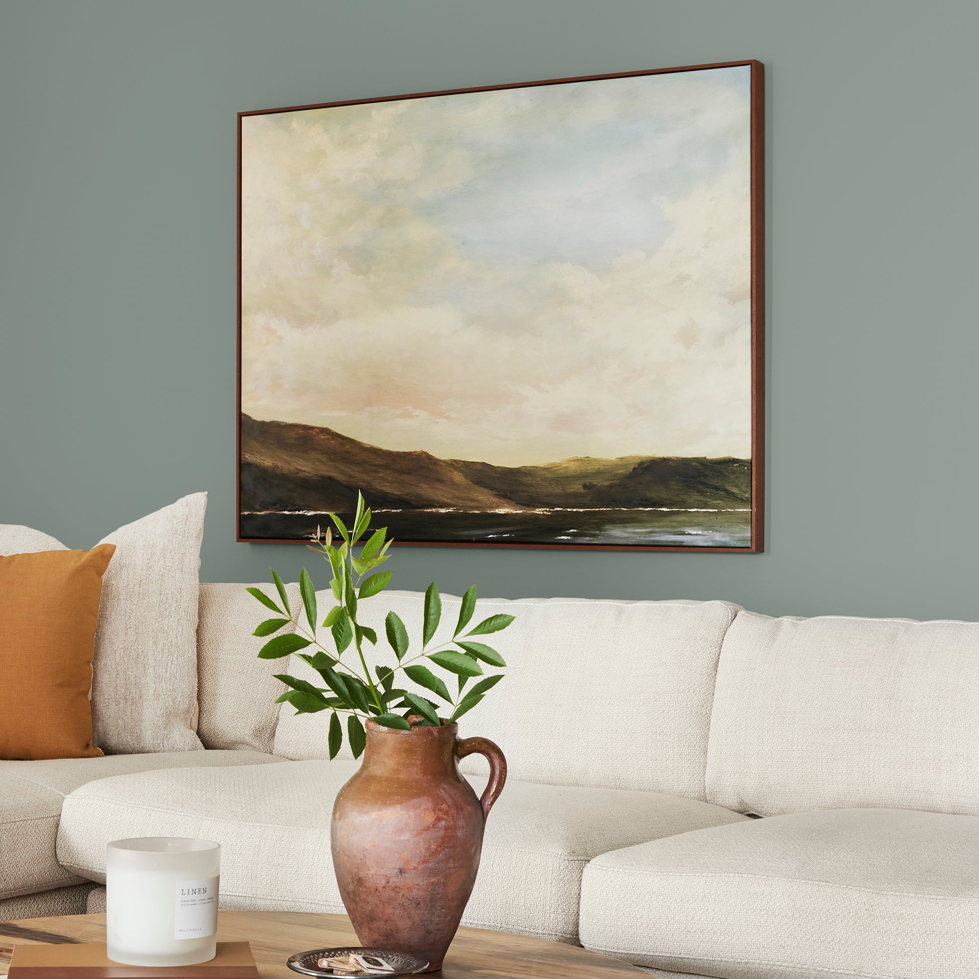 Deep gray with hues of rich blue and sage green interior paint named silverado sage shown painted on lving room wall