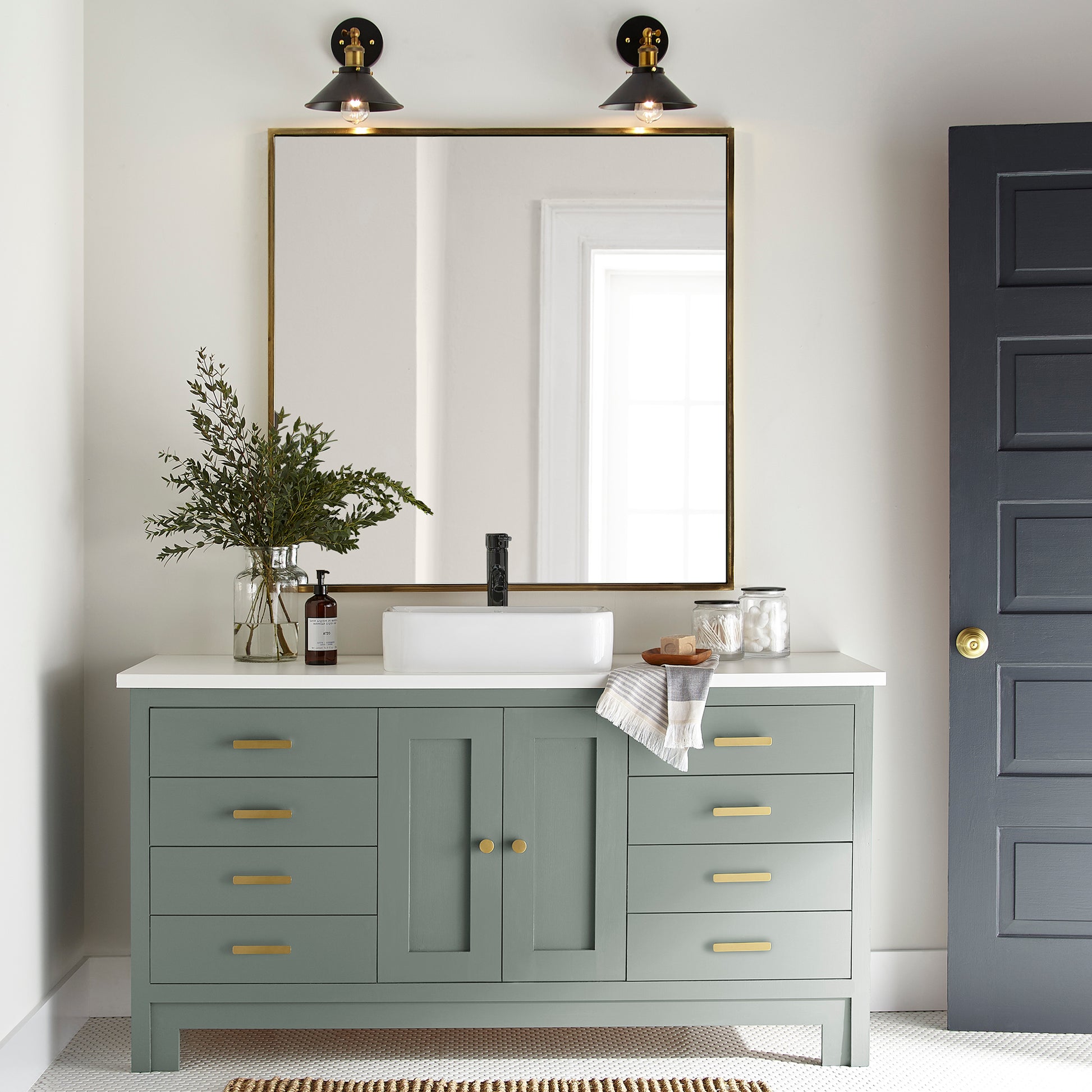Deep gray with hues of rich blue and sage green paint named silverado sage shown painted on bathroom cabinet