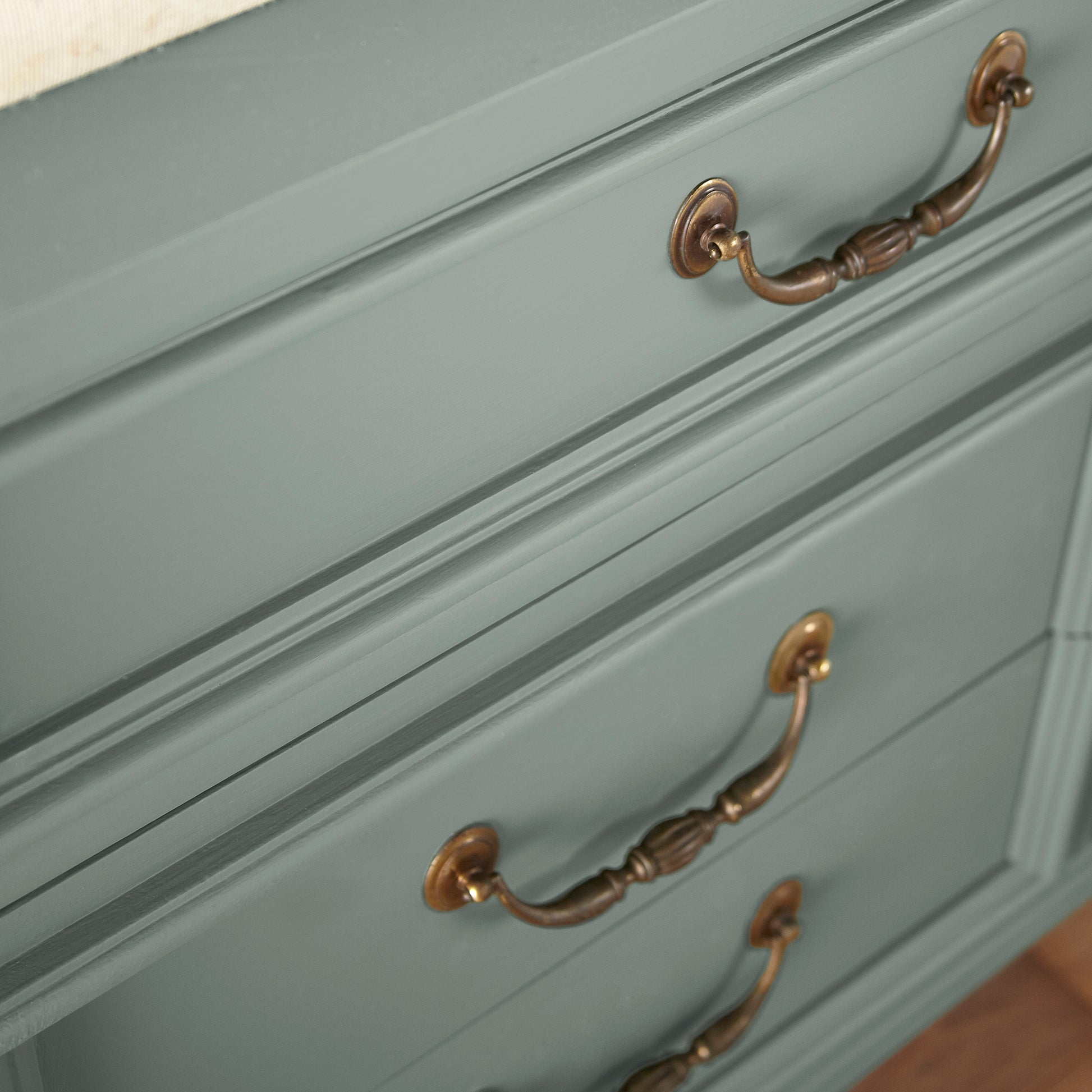 Deep gray with hues of rich blue and sage green paint named silverado sage shown painted on cabinet