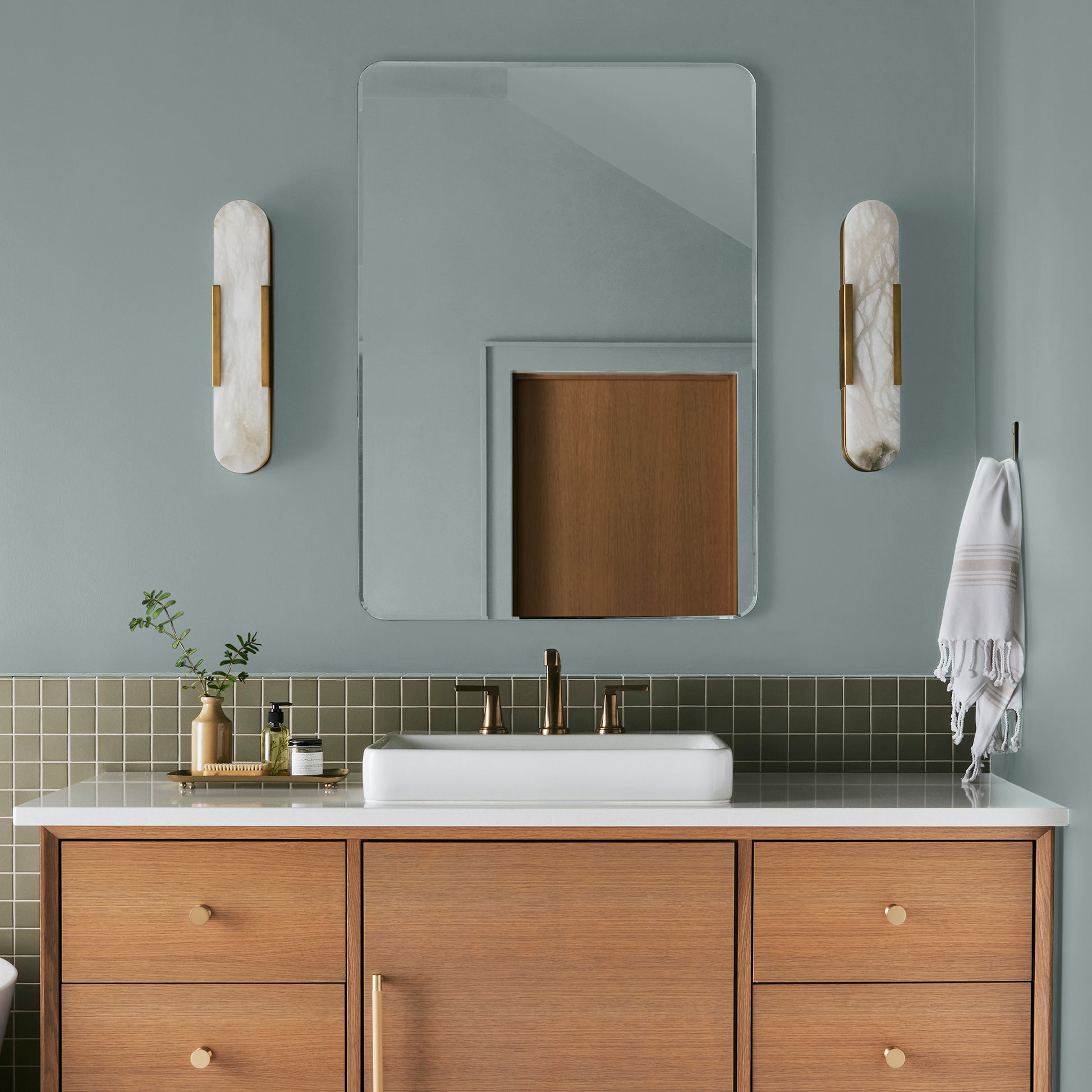 muted grey blue interior paint named rainy days shown painted on bathoom wall